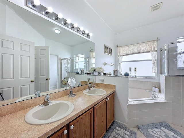 bathroom with vanity, lofted ceiling, and plus walk in shower