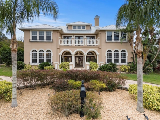 rear view of house featuring a balcony