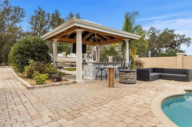1665 Blue Heron Ln, Lakeland, FL 33813 - view of swimming pool with a gazebo, a patio, and a ceiling fan