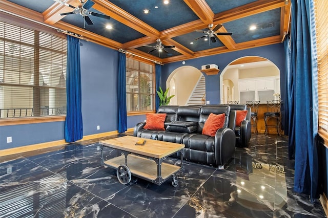 1665 Blue Heron Ln, Lakeland, FL 33813 - home theater featuring marble tiled floors, a ceiling fan, arched walkways, coffered ceiling, and beamed ceiling