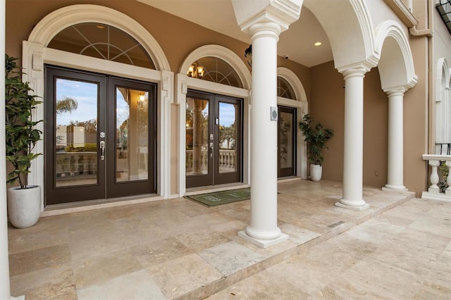 1665 Blue Heron Ln, Lakeland, FL 33813 - view of exterior entry with french doors and stucco siding