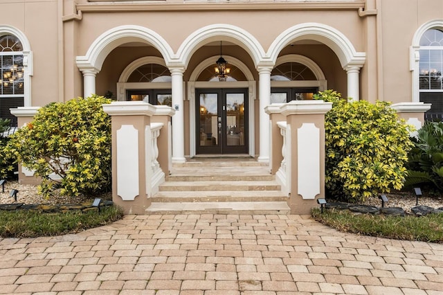 1665 Blue Heron Ln, Lakeland, FL 33813 - doorway to property with french doors and stucco siding
