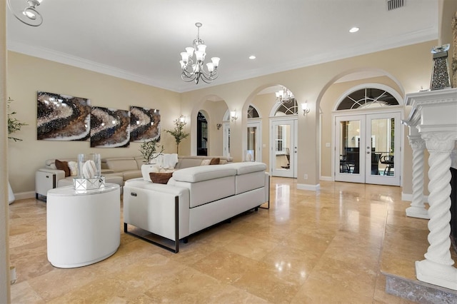 1665 Blue Heron Ln, Lakeland, FL 33813 - living area featuring arched walkways, a chandelier, french doors, ornamental molding, and recessed lighting