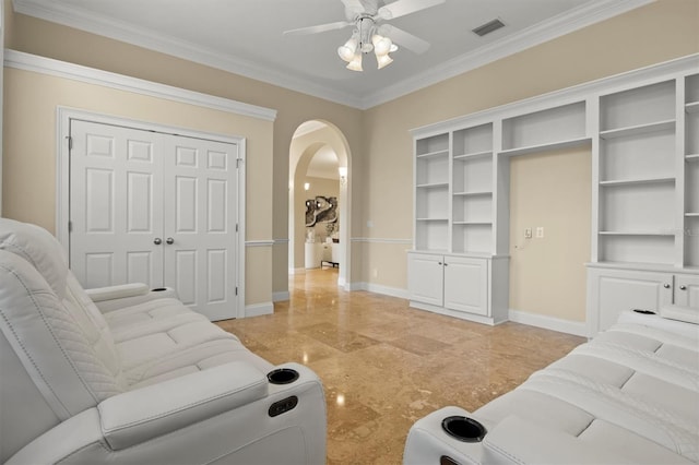 1665 Blue Heron Ln, Lakeland, FL 33813 - living room featuring arched walkways, a ceiling fan, ornamental molding, and baseboards