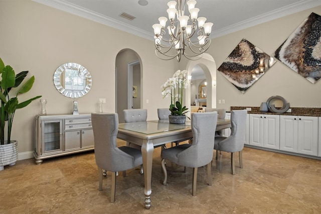 1665 Blue Heron Ln, Lakeland, FL 33813 - dining area featuring arched walkways, ornamental molding, and a chandelier
