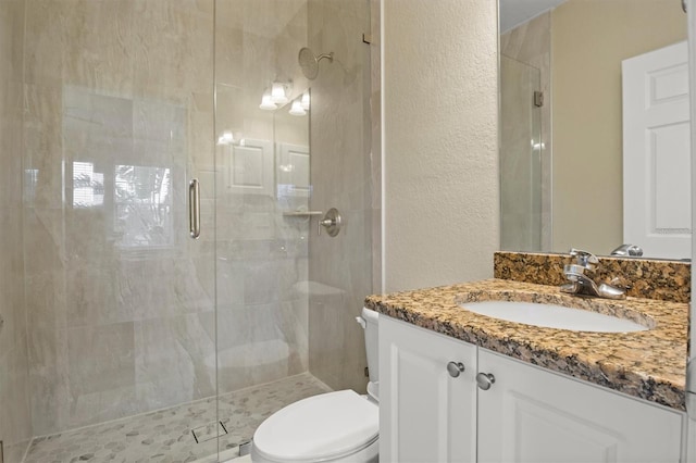 1665 Blue Heron Ln, Lakeland, FL 33813 - full bath with a stall shower, toilet, vanity, and a textured wall