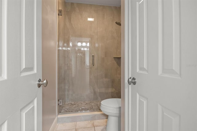 1665 Blue Heron Ln, Lakeland, FL 33813 - full bathroom featuring toilet, a shower stall, and tile patterned flooring