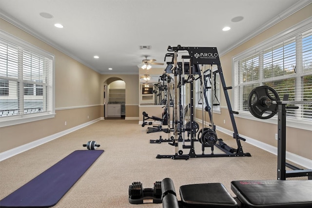 1665 Blue Heron Ln, Lakeland, FL 33813 - workout area with crown molding, arched walkways, carpet floors, baseboards, and recessed lighting