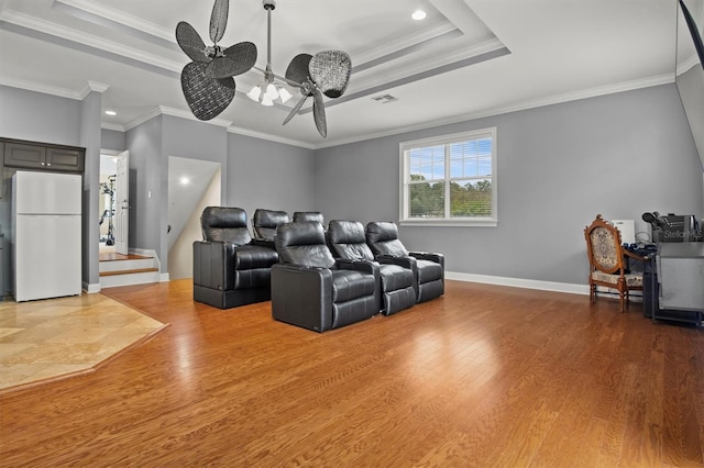 1665 Blue Heron Ln, Lakeland, FL 33813 - home theater with ornamental molding, wood finished floors, baseboards, recessed lighting, and a raised ceiling