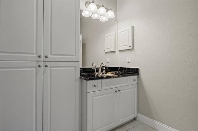 1665 Blue Heron Ln, Lakeland, FL 33813 - bathroom featuring tile patterned flooring, vanity, and baseboards