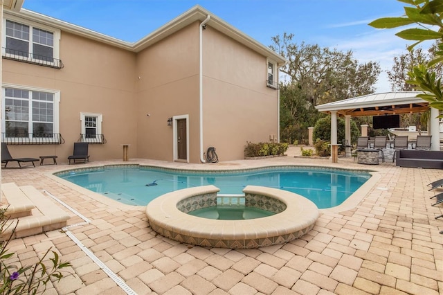 1665 Blue Heron Ln, Lakeland, FL 33813 - view of swimming pool with a patio, a gazebo, and a pool with connected hot tub