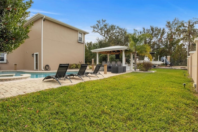 1665 Blue Heron Ln, Lakeland, FL 33813 - view of green lawn featuring area for grilling, a patio area, a gazebo, and a pool with connected hot tub