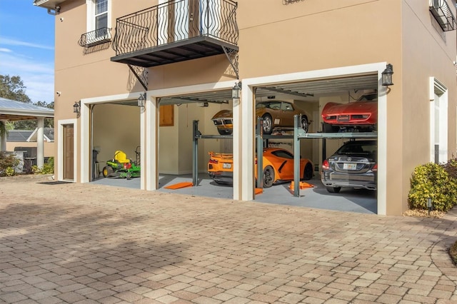 1665 Blue Heron Ln, Lakeland, FL 33813 - view of patio / terrace with a balcony and a garage