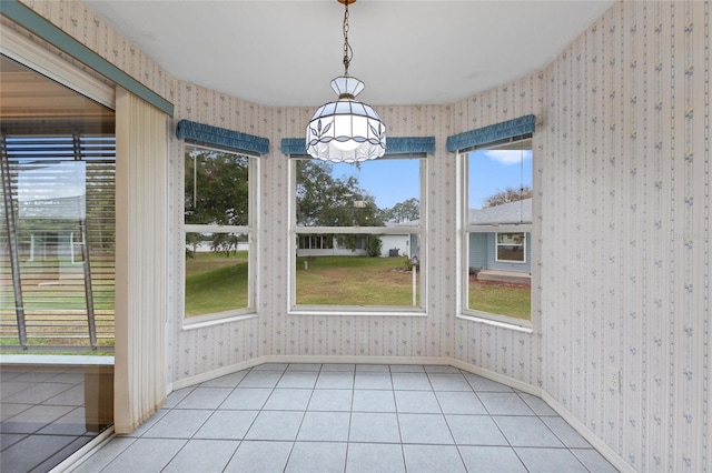 unfurnished dining area with light tile patterned floors