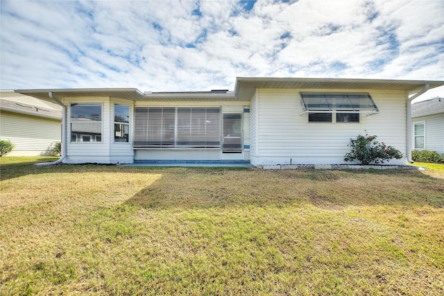 ranch-style home with a front lawn