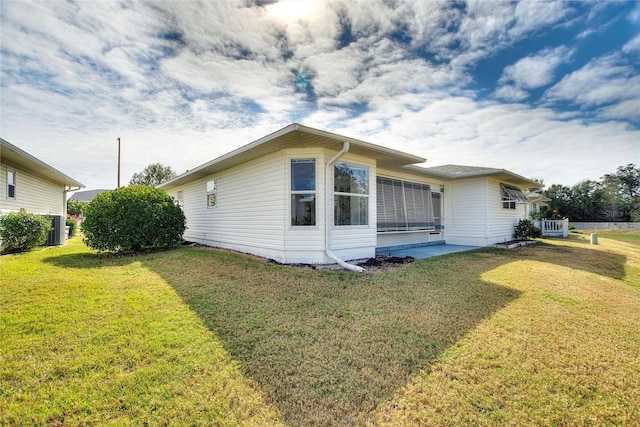 view of home's exterior featuring a lawn