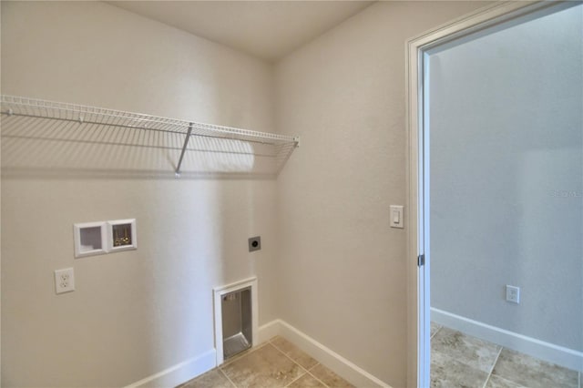 clothes washing area with washer hookup, hookup for an electric dryer, and light tile patterned flooring