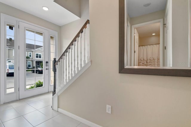 tiled foyer entrance featuring plenty of natural light