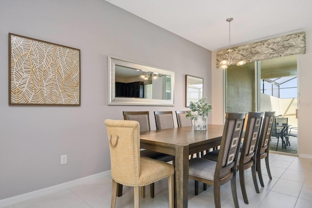 tiled dining area featuring a notable chandelier