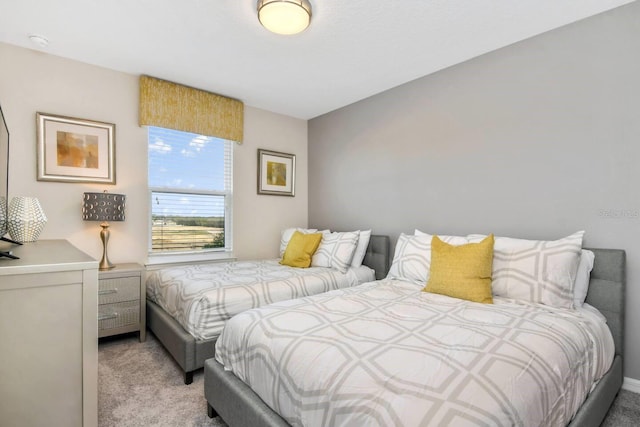 bedroom featuring light colored carpet