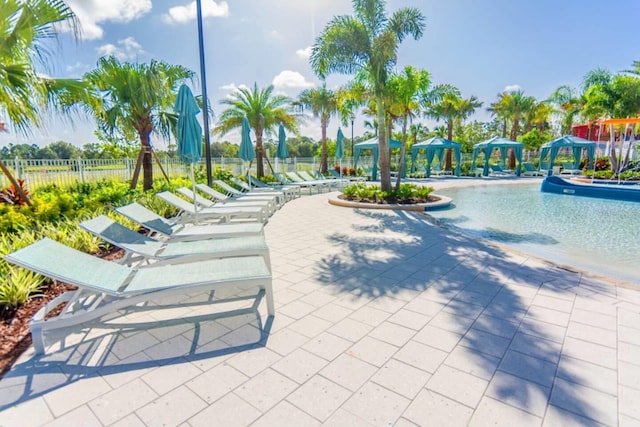 view of property's community with a patio area, a gazebo, and a swimming pool