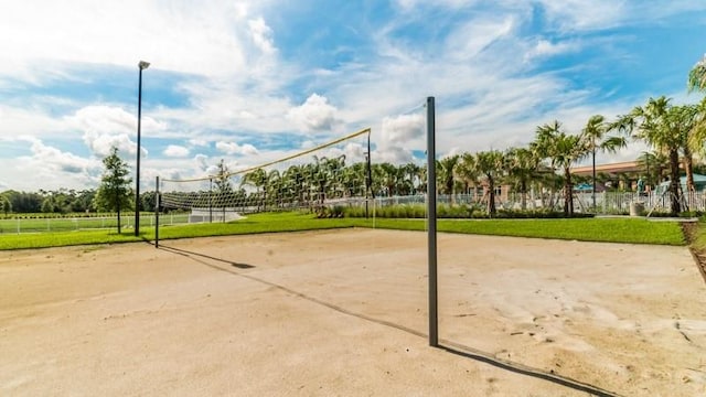 view of community with a yard and volleyball court