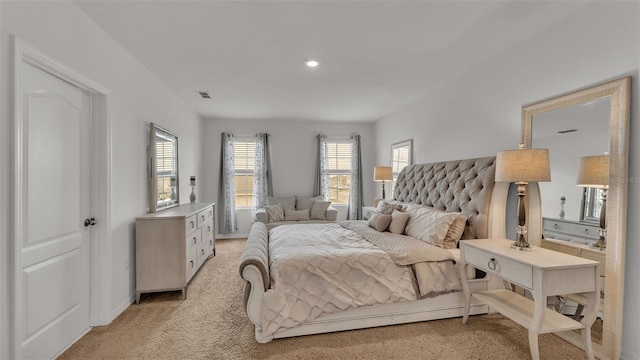 bedroom featuring light carpet