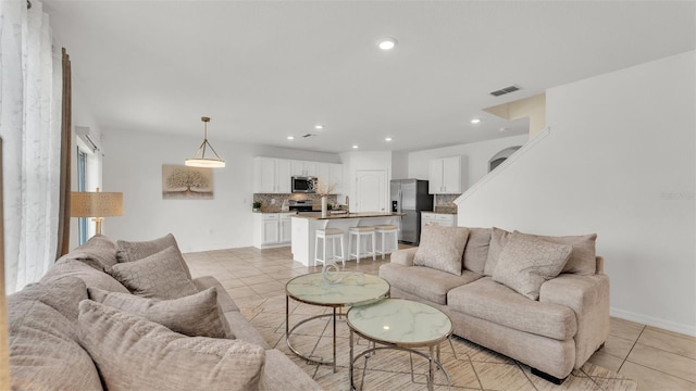 living room with light tile patterned floors