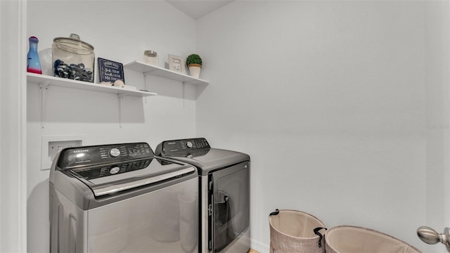 washroom featuring washer and dryer