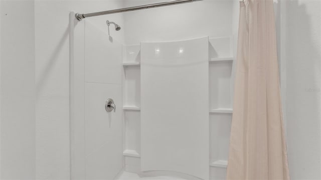 bathroom featuring a shower with curtain