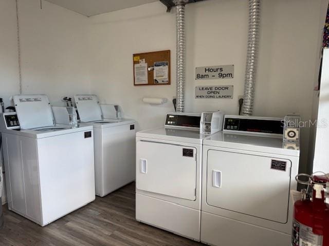 washroom featuring washer and clothes dryer and dark hardwood / wood-style floors