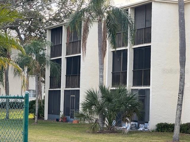 view of building exterior with fence