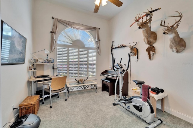 carpeted home office with ceiling fan