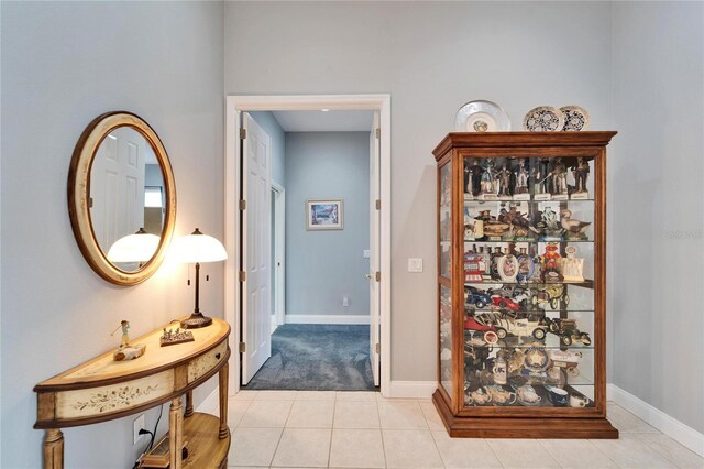 hall with light tile patterned flooring