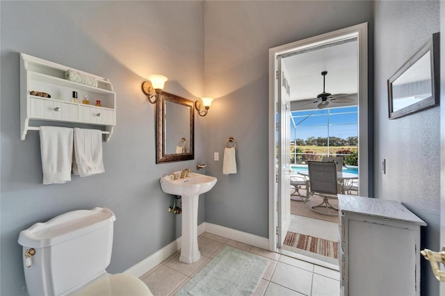 bathroom with toilet, tile patterned flooring, and ceiling fan