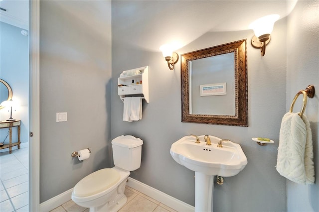 bathroom featuring toilet, crown molding, and tile patterned flooring