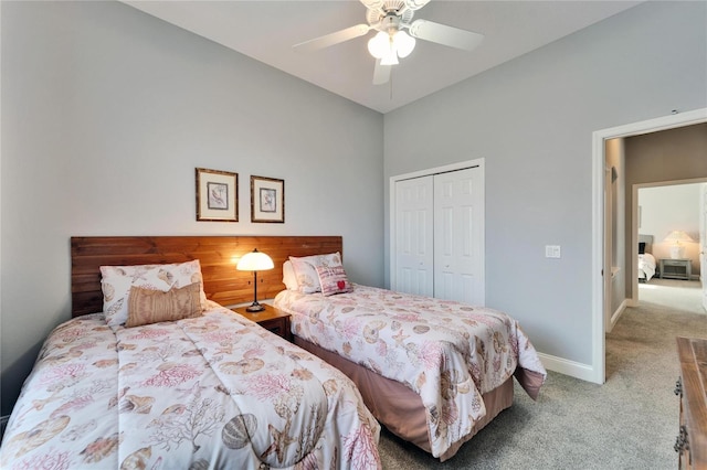 bedroom featuring light carpet, a closet, and ceiling fan