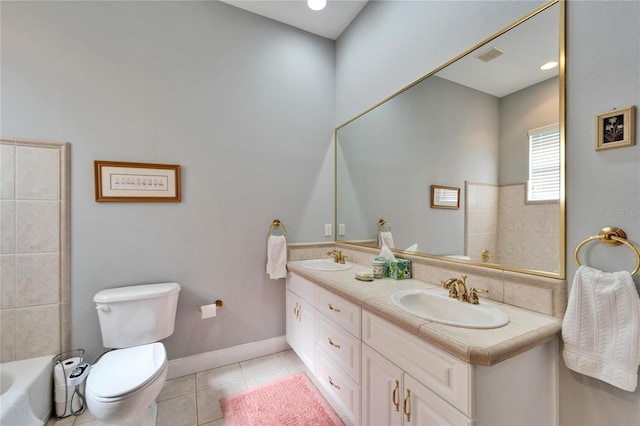 bathroom featuring vanity, toilet, and tile patterned flooring