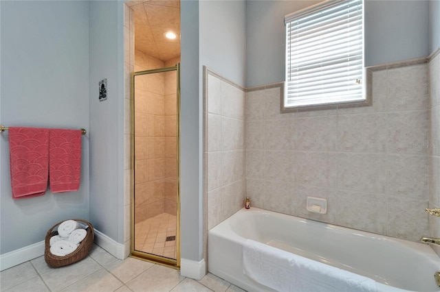 bathroom with plus walk in shower and tile patterned flooring