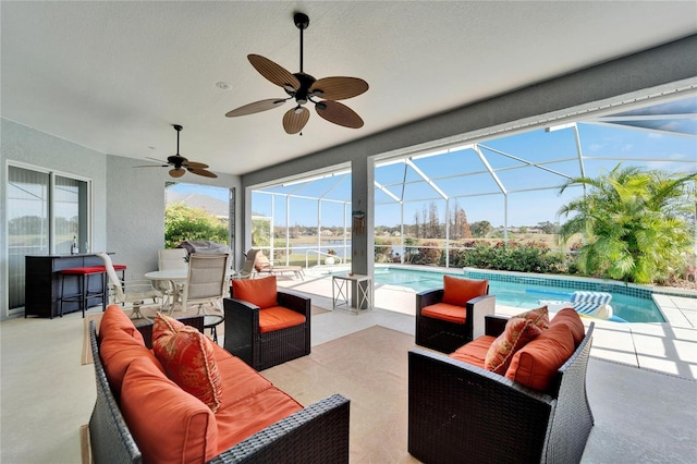 view of patio / terrace featuring glass enclosure, an outdoor living space, and ceiling fan