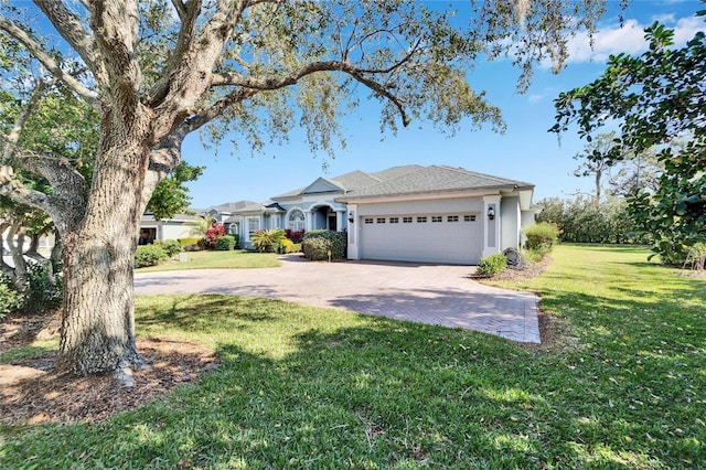 ranch-style house with a garage and a front yard