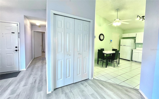 interior space featuring a textured ceiling and light hardwood / wood-style floors