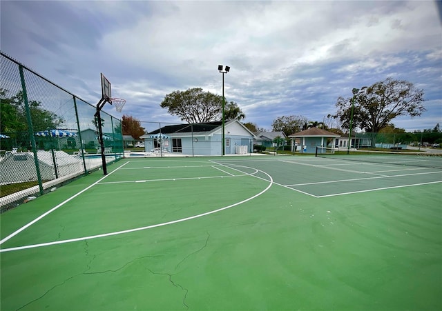 view of basketball court with tennis court