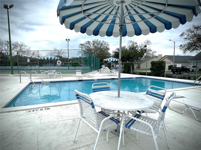 view of swimming pool featuring a patio