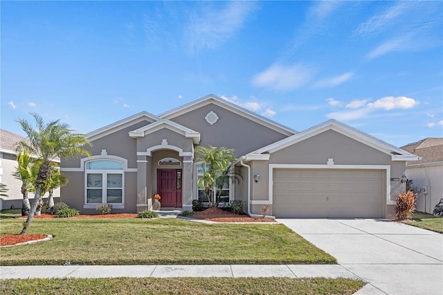 ranch-style house featuring a garage and a front yard