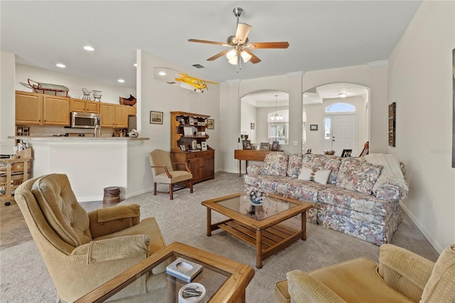 living room with light carpet and ceiling fan