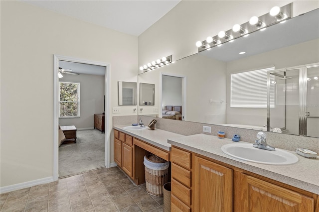 bathroom featuring vanity, a shower with door, and tile patterned floors