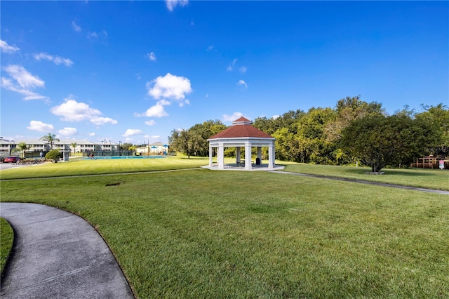 surrounding community featuring a gazebo and a yard