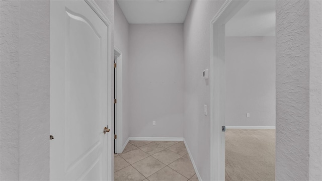 hallway featuring light tile patterned flooring