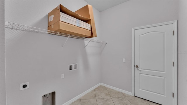 laundry area with light tile patterned floors, washer hookup, and hookup for an electric dryer